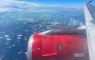 Airplane view of the sky and engine.